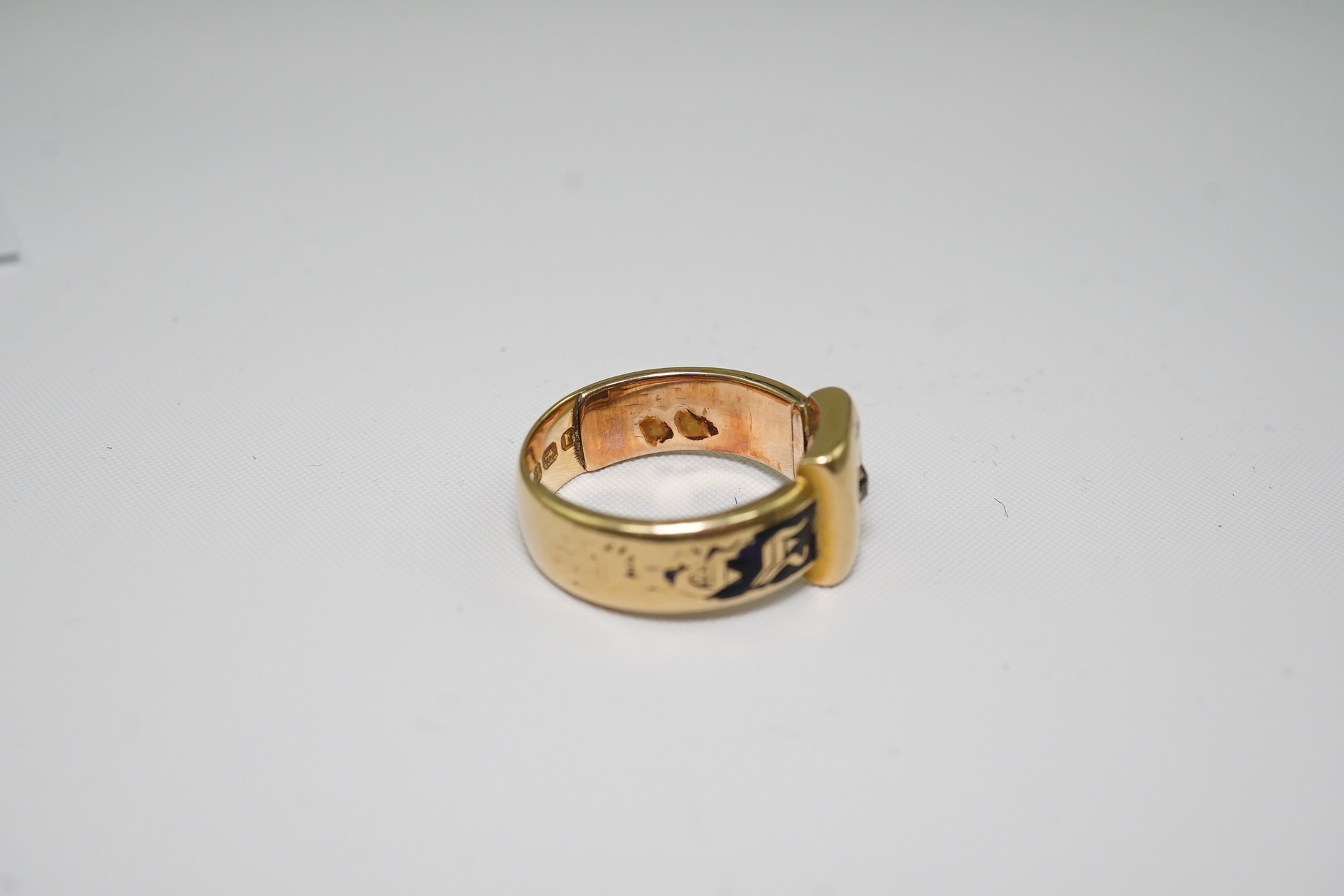 A 19th century 18ct gold, black enamel and single stone diamond set mourning ring